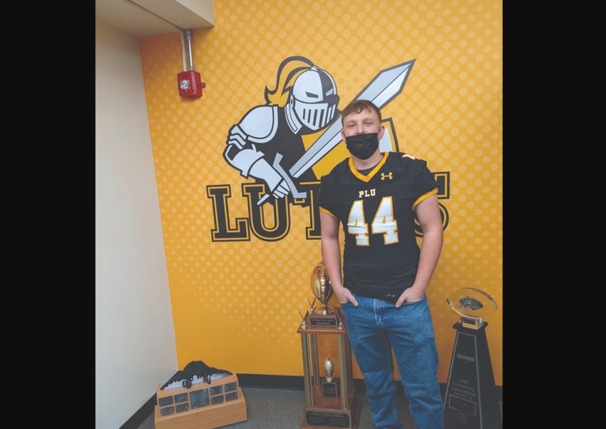 Oakville High School senior Derek Ruymann poses for a photo at Pacific Lutheran University. Ruymann, an all-league linebacker for the Acorns, will join the Lutes&rsquo; football team next season.