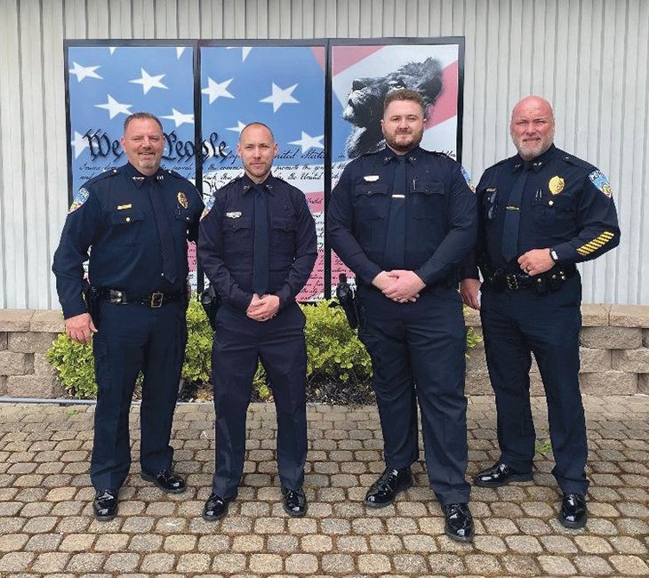 New officers Brian Mooney and Joseph Murphy are pictured with Yelm Police Chief Todd Stancil and Assistant Chief Rob Carlson.
