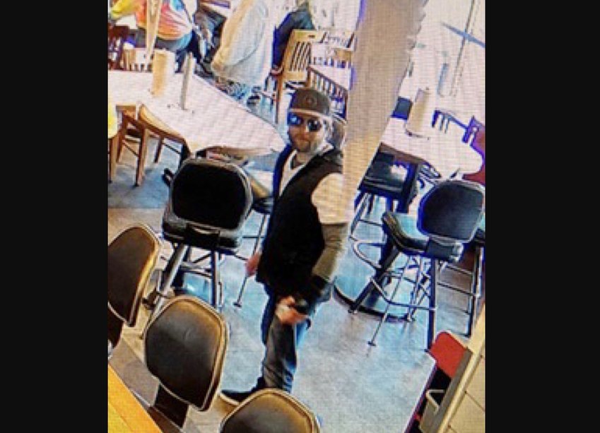 Surveillance video from several robberies captured the suspect, who police describe as a white man, between 30 and 35 years old, with brown hair and a brown beard. He stands about 5 feet, 8 inches tall and usually wears a face covering and a baseball cap.