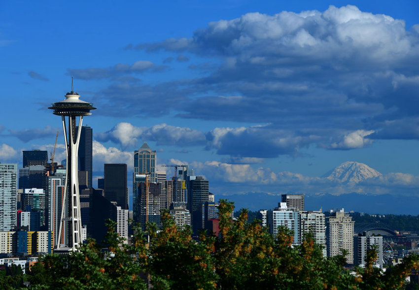 A general view of the Seattle Space Needle and downtown skyline with Mount Rainier in the background on June 8, 2019, in Seattle. (Donald Miralle/Getty Images for Rock'n'Roll Marathon/TNS)