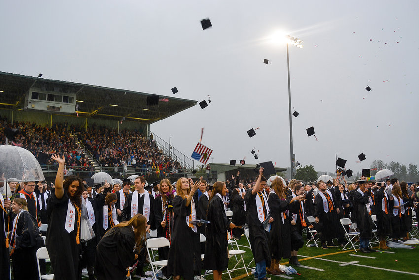 Battle Ground High School&rsquo;s Class of 2022 tosses their graduation caps in the air before saying goodbye at their graduation ceremony in Battle Ground on June 10.