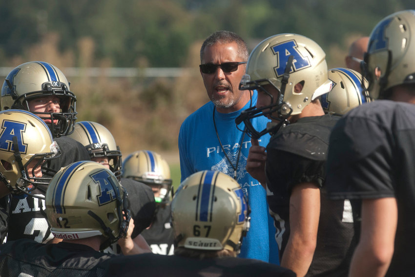File Photo / The Chronicle.Adna football coach K.C. Johnson addresses his team during a preseason practice in 2015.