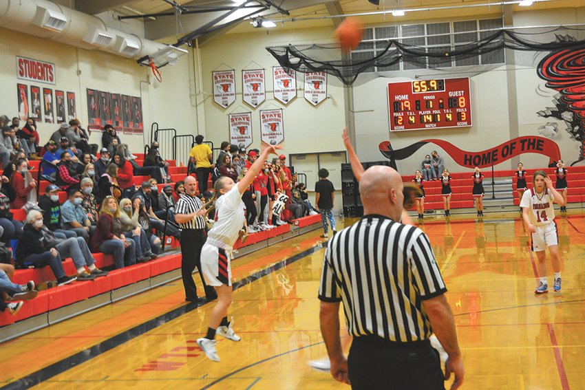 Sophomore guard Sadie Tanner attempts a 3-point shot against River Ridge at a game in January.
