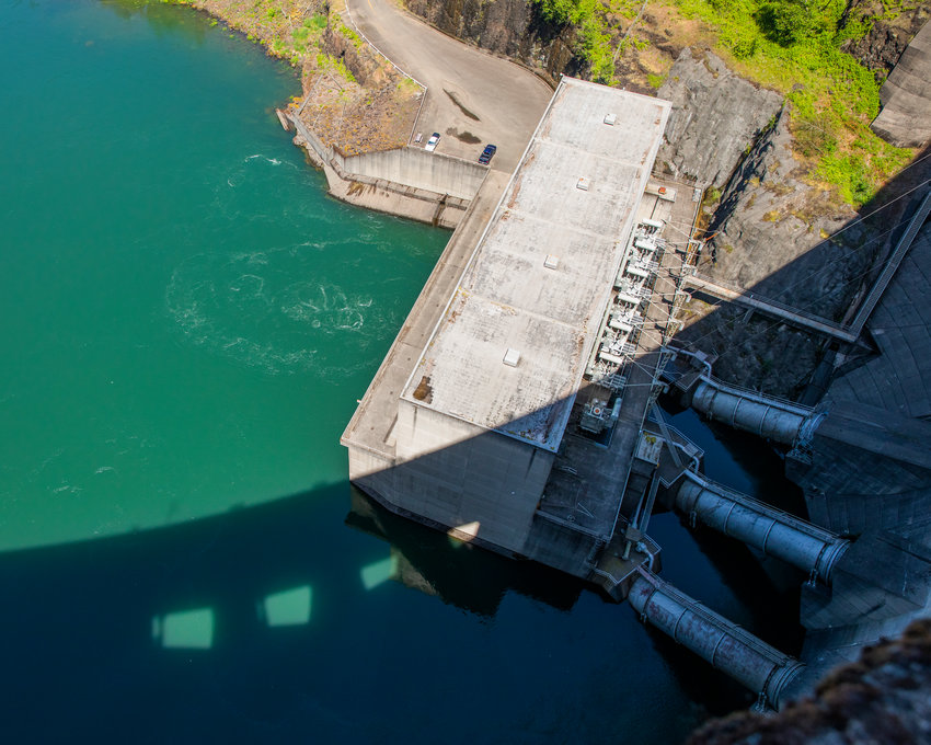 The Mossyrock Dam casts a shadow on the Tacoma City Light powerhouse.