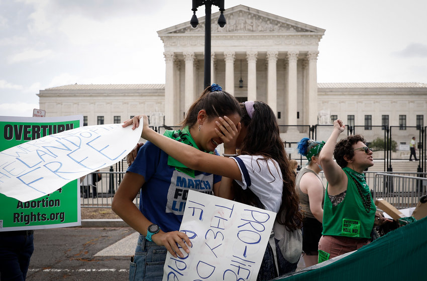 Pro-life activists react to the Dobbs v Jackson Women&rsquo;s Health Organization ruling which overturns the landmark abortion Roe v. Wade case in front of the U.S. Supreme Court on June 24, 2022, in Washington, DC.   (Anna Moneymaker/Getty Images/TNS)