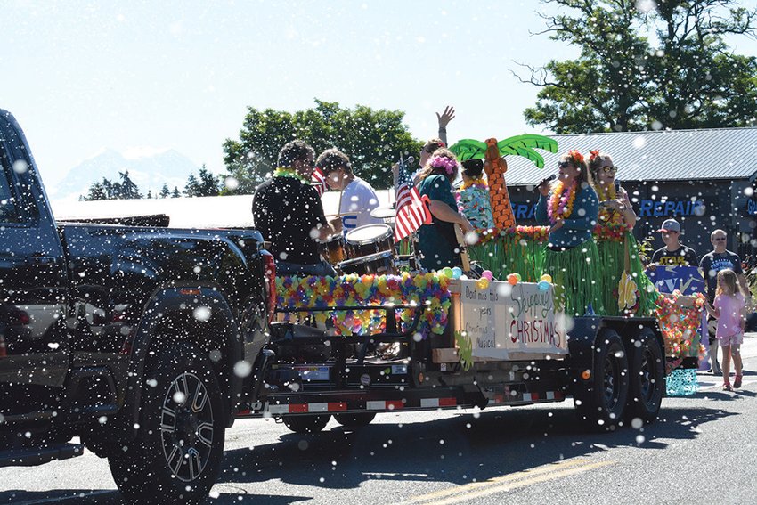 A parade float promoting a Christmas play makes its way down Yelm Avenue during the annual Prairie Days Parade on June 25.