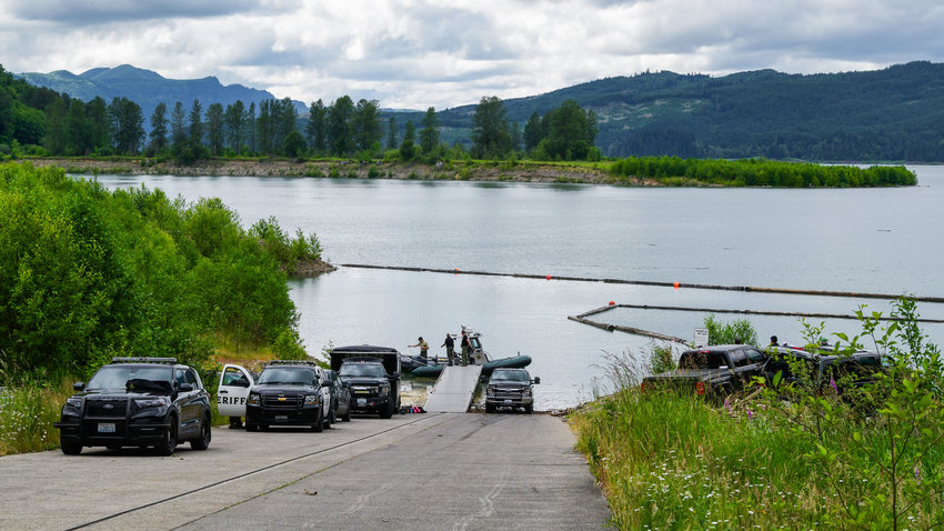 Lewis County Sheriff's Office deputies and the Thurston County Dive Team wrap up a search after making a recovery near the Taidnapam North Boat Launch Tuesday afternoon.