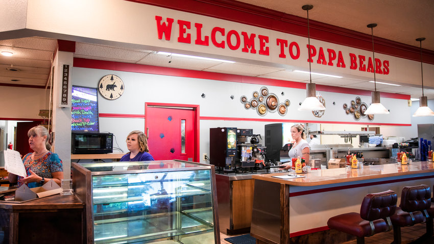 A wall sign reads &ldquo;Welcome to Papa Bears&rdquo; on opening day.