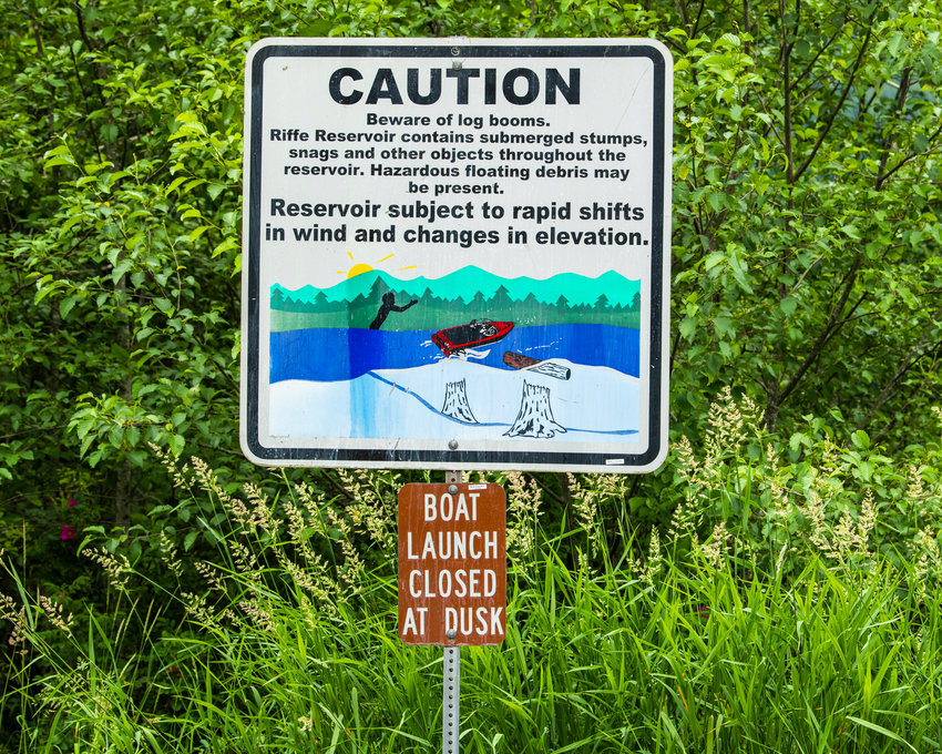 A sign cautions visitors about log booms in the Riffe Reservoir near the Taidnapam North Boat Launch.