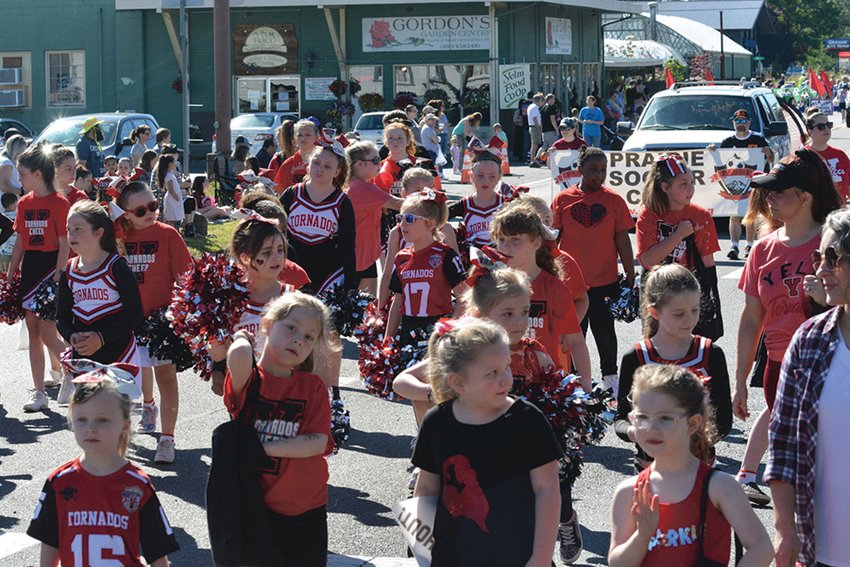 Young cheerleaders participate in the Prairie Days Parade on June 25. The Yelm Tornado Youth Football and Cheer program will host a clothing drive to help fund its activities.