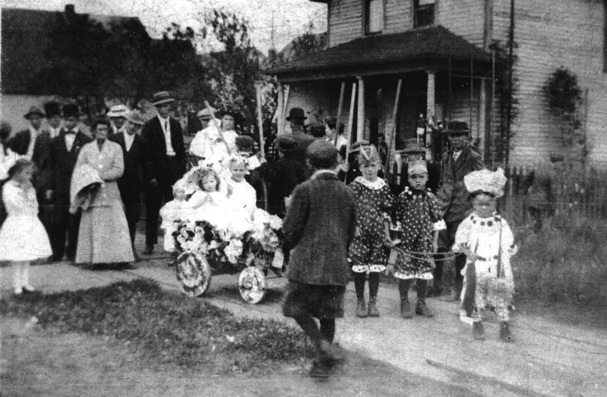 This Fourth of July parade took place in about 1911 in Pe Ell. The Allen children took first place with their float on that day. In the lead is Bob Allen, who is thought to be about 4 years old at the time. Behind him are his brothers John and Rex. All three boys are hitched to the wagon pulling Catherine (on the left) and an unknown neighbor child (on the right). The children&rsquo;s parents were Harvey and Mabel Allen of Pe Ell. Harvey was a barber and fiddle player and Bob was the father of this photo&rsquo;s contributor.
