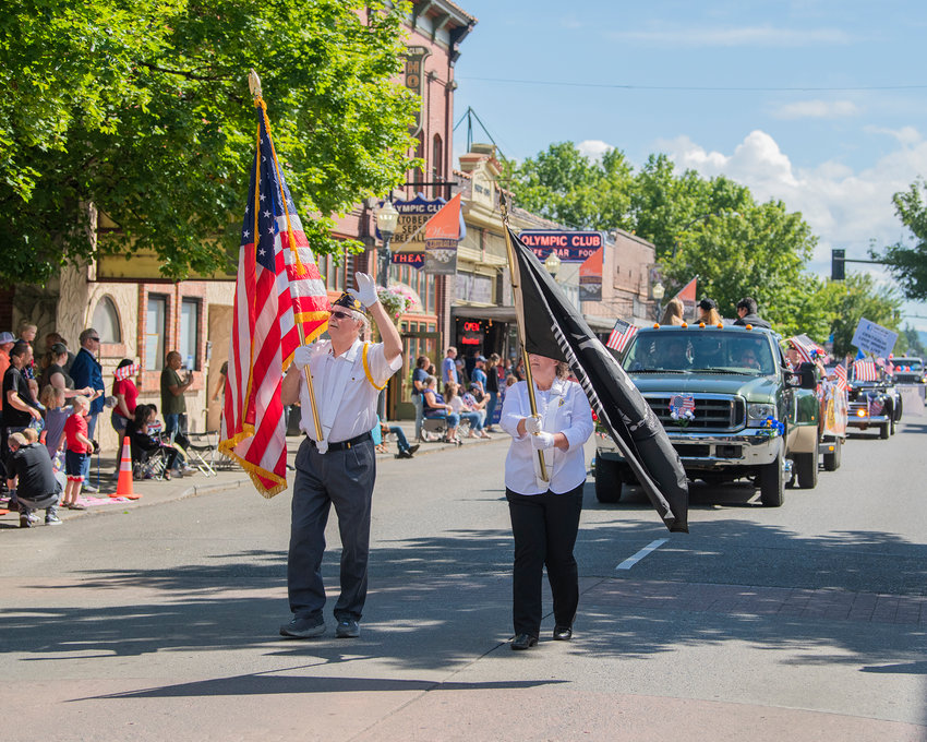 Flags are displayed in downtown Centralia during the Summerfest parade.