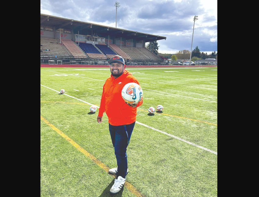 New Centralia High School girls soccer coach Noel Vazquez poses for a photo on the Tiger Stadium field.