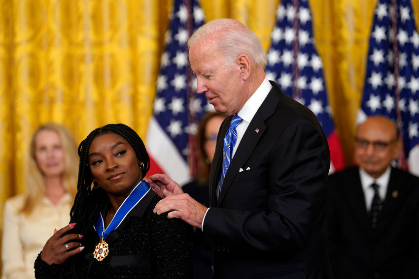 U.S. President Joe Biden awards the Presidential Medal of Freedom to Olympic gymnast Simone Biles in the East Room at the White House in Washington, D.C., on Thursday, July 7, 2022. (Yuri Gripas/Abaca Press/TNS)
