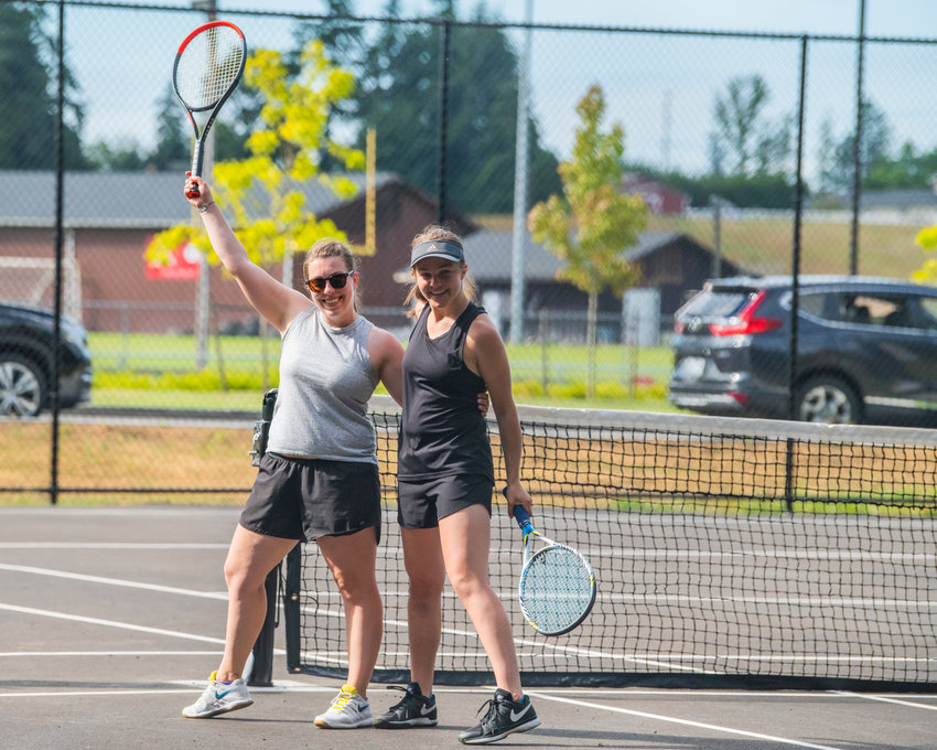 Doubles partners Isabel Vander Stoep and Emma Lund pose for a photo after winning a tiebreaker to earn the women&rsquo;s doubles championship at the Toledo Cheese Days tennis tournament on Saturday.