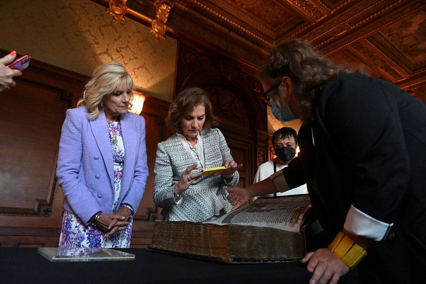 Mexican first lady Beatriz Gutierrez Muller, second from right, uses her phone to record the explanation of a specialist at the Library of Congress as she and U.S. first lady Jill Biden left, tour the U.S. Library of Congress in Washington, D.C. on Tuesday, July 12, 2022. (Roberto Schmidt/AFP/Getty Images/TNS)