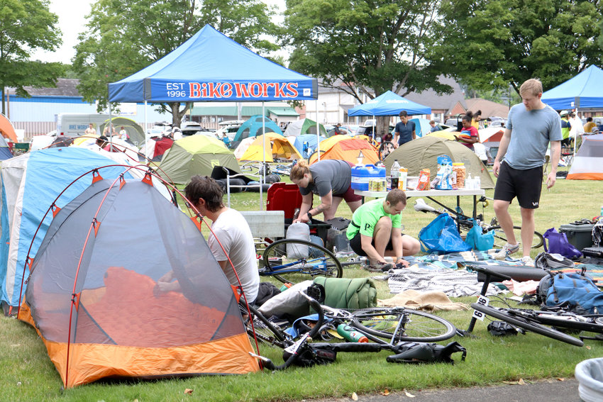 Cyclists set up camp on the grounds of Centralia College, the official halfway point of the Seattle to Portland Classic, in Centralia in July 2023.