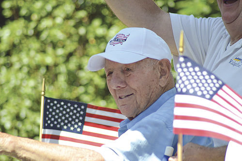 John Burrow takes part in the 2015 Ridgefield Fourth of July parade, one day before his 100th birthday.