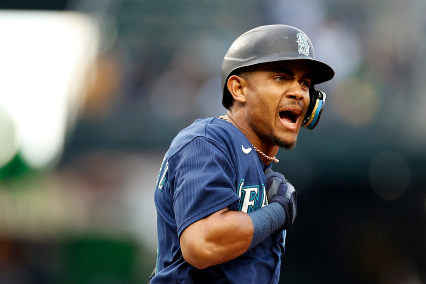 Julio Rodriguez (44) of the Seattle Mariners celebrates his three-run home run in the third inning against the Oakland Athletics at T-Mobile Park on May 23, 2022, in Seattle, Washington.