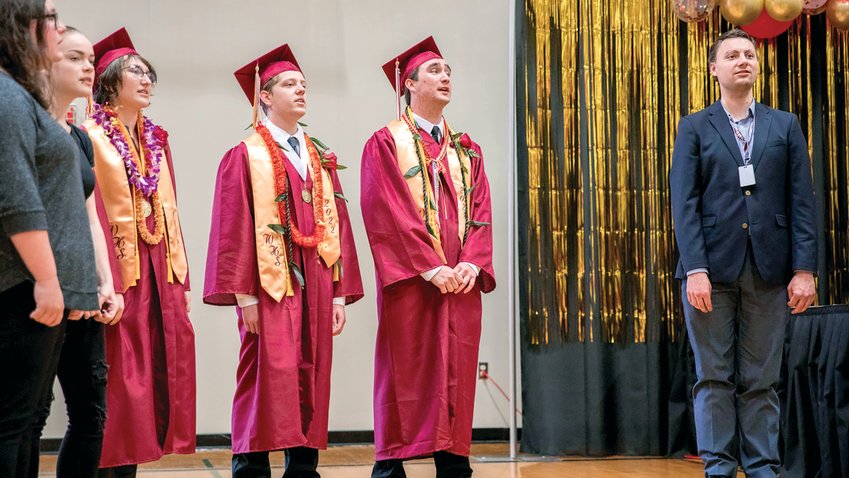 From left, 2022 Winlock High School graduates Taylor Ruiz, Neal Patching and Mekhi Morlin sing &ldquo;The Rainbow Connection&rdquo; during the graduation ceremony in early June.