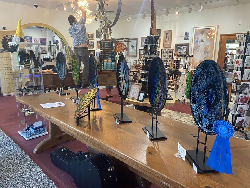Artwork is displayed at the InGenius! Gallery and Boutique shop in Yelm. The business will celebrate its one year anniversary on July 30.