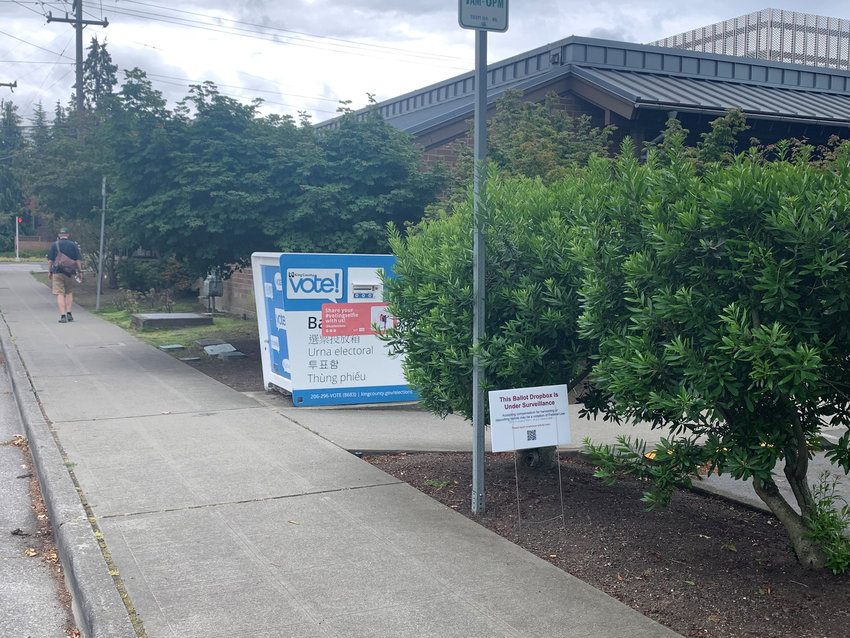 A sign posted outside the Seattle Public Library&rsquo;s Broadview Branch on Sunday, July 17, 2022, warns that a ballot box there is &quot;under surveillance.&quot; (Jim Brunner/The Seattle Times/TNS)