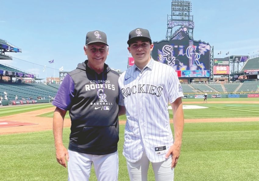 Colorado Rockies manager Bud Black poses for a photo with Jackson Cox on Wednesday, after Cox signed a contract to play for the Rockies organization. Black and Cox are both from Cowlitz County, Washington.