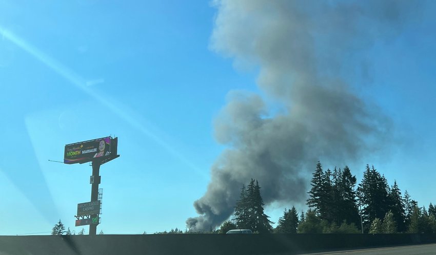 Smoke rises from the fires in south Thurston County in this photograph taken from Interstate 5.