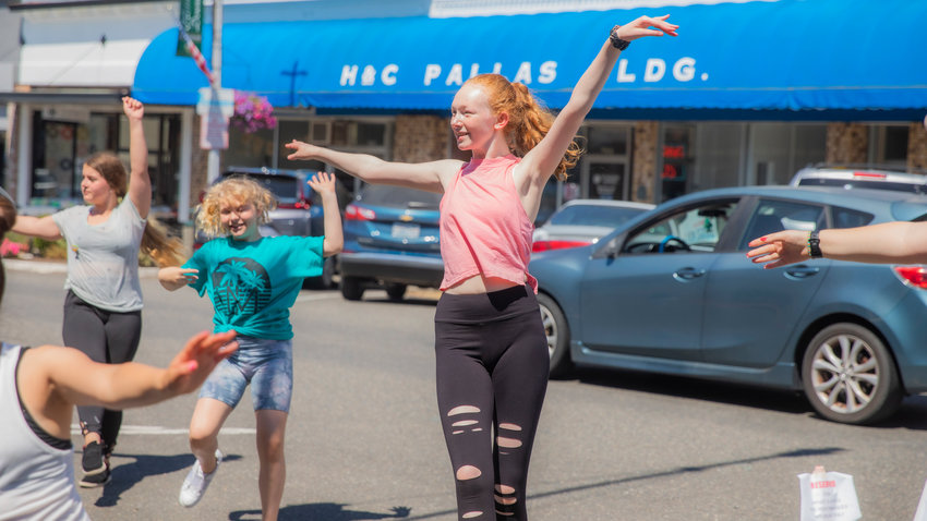 Dancers move to music outside the Southwest Washington Dance Center in Chehalis in July 2022.
