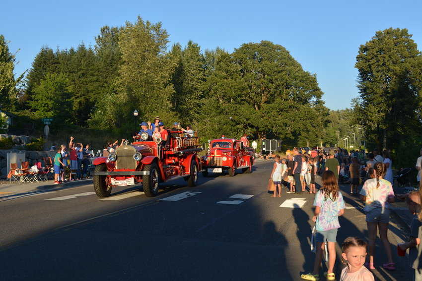 The Streissguth family rides on vintage fire trucks at the La Center Our Days parade on July 29.