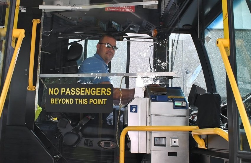 A C-Tran bus driver waits before going to his next stop.