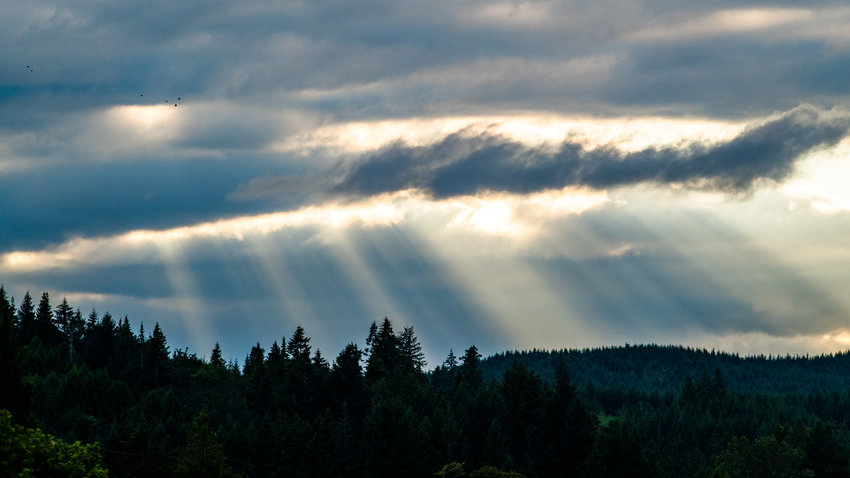 Sun rays break through the clouds in Chehalis on Wednesday.