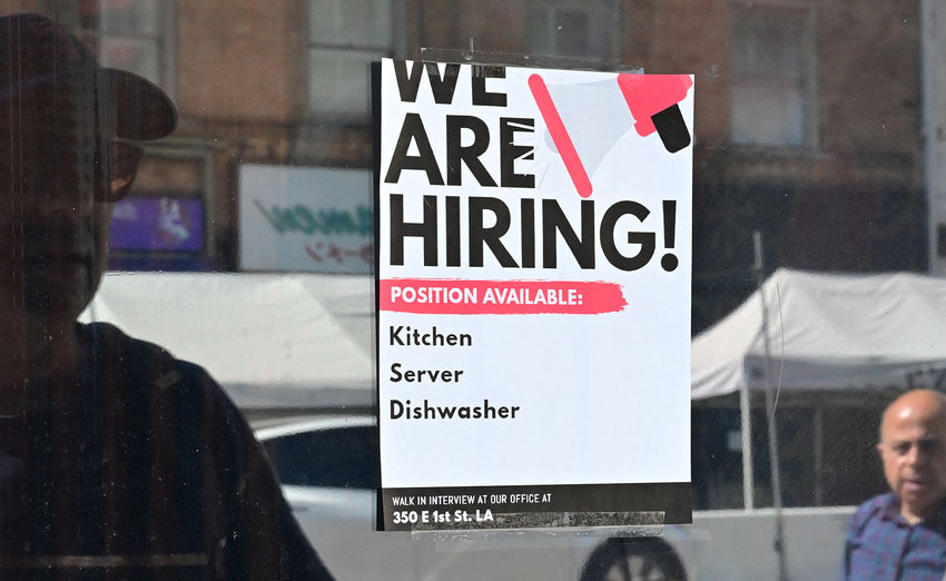 A &quot;We Are Hiring&quot; sign is posted in front of a restaurant in Los Angeles, California on Aug. 17, 2022. (Frederic J. Brown/AFP via Getty Images/TNS)