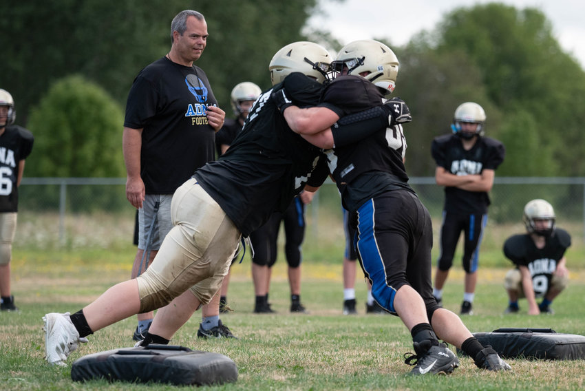 Two Adna lineman work through a competition drill during practice Aug. 20.
