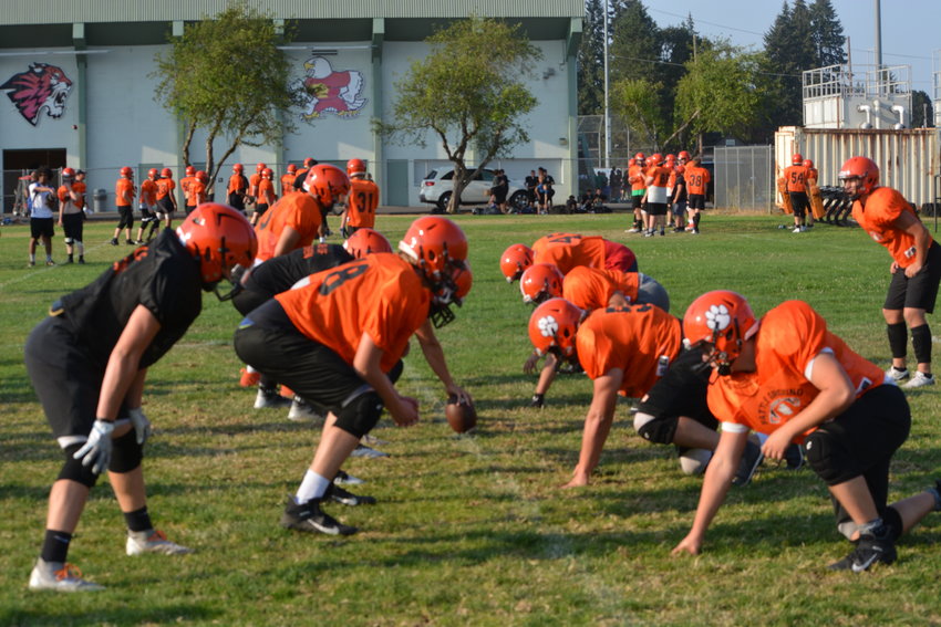 The Battle Ground Tigers practice getting into position at Battle Ground High School on Aug. 31.