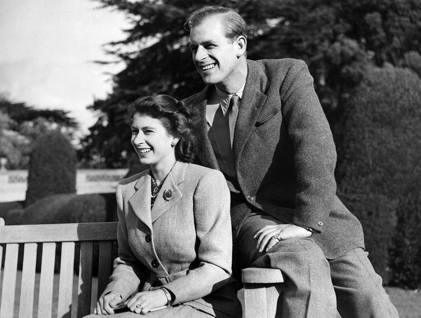 Britain's Princess Elizabeth (future Queen Elizabeth II) and her husband Philip, Duke of Edinburgh, pose during their honeymoon, Nov. 25, 1947, in Broadlands estate, Hampshire. (-/AFP via Getty Images/TNS)