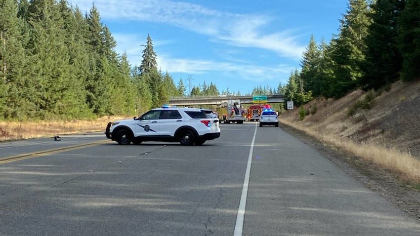 Washington State Patrol vehicles block off U.S. 101 near Shelton in both directions around a three-vehicle wreck on Wednesday.