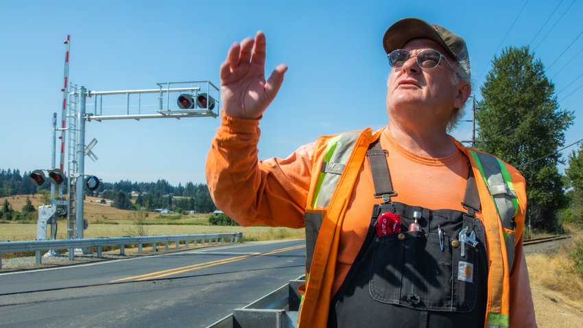 Bill Deutscher, CCRM track and project manager, talks about the visibility for newly installed crossing guards with lights on a recent afternoon in Adna.
