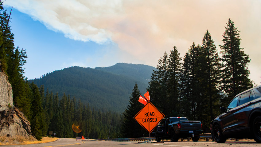 Smoke from the Goat Rocks Fire billows over the hills seen from between White Pass and Packwood on U.S. Highway 12 on Saturday afternoon.