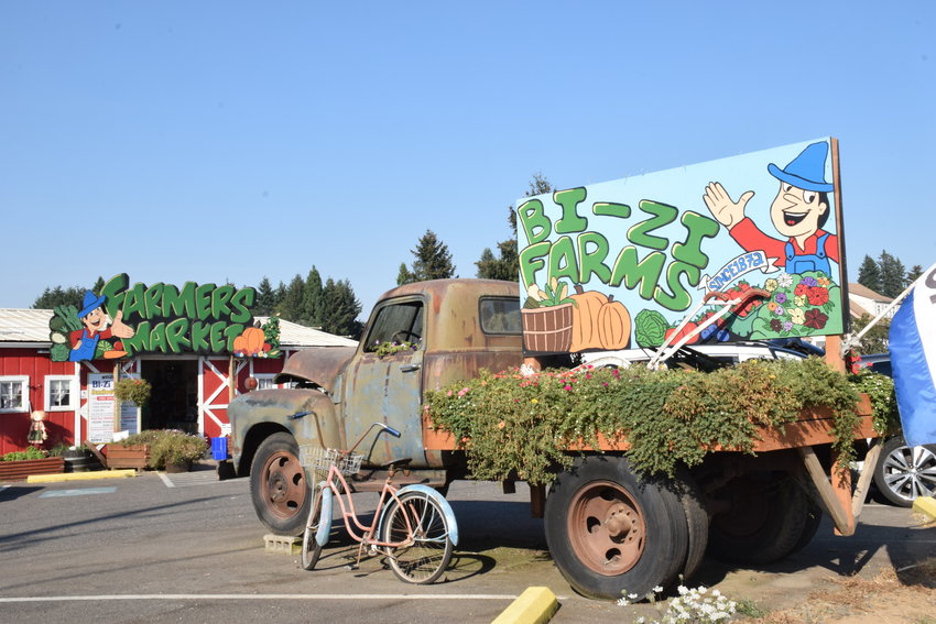 A sign on an antique truck on Sept. 9 invites customers to Bi-Zi Farms in Brush Prairie.