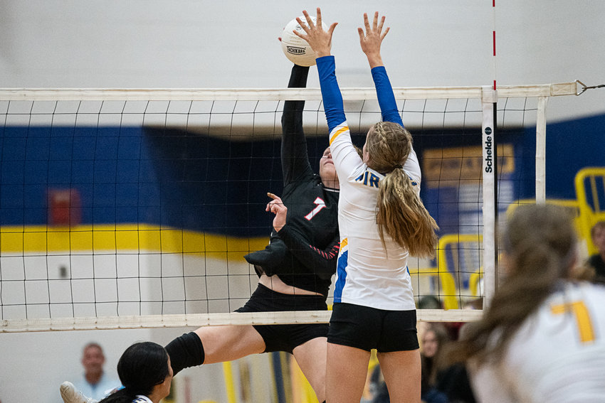 Mossyrock's Paige Houghtelling looks to sneak a kill past Adna Sept. 12.