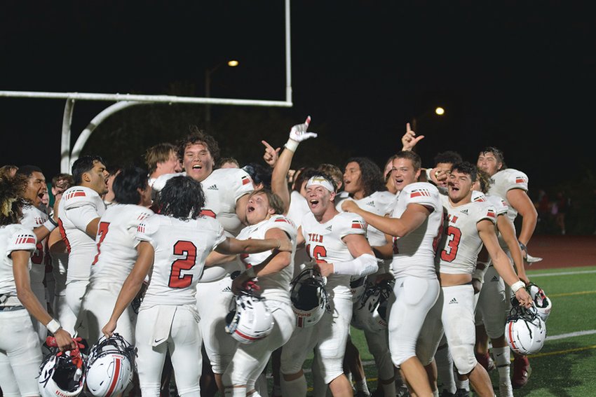 Yelm celebrates their blowout victory over Union in the endzone on Friday, Sept. 9.