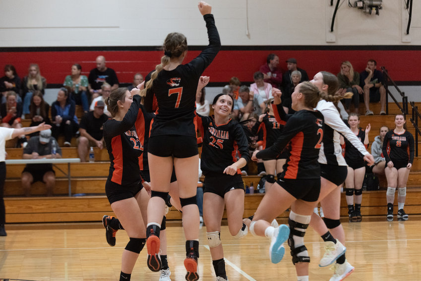 The Centralia Tigers celebrate a pont during their four-set win at Tenino on Sept. 14.