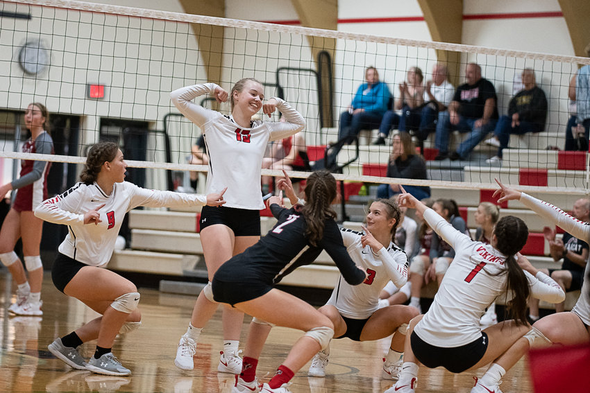Mossyrock middle blocker Hailey Brooks (15) celebrates with her team after a point against W.F. West Sept. 15.