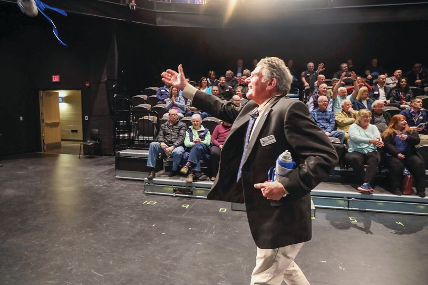 Ron Onslow chucks a T-shirt bundle into the audience at the end of the State of the City address hosted at Ridgefield High School in this 2019 file photo.