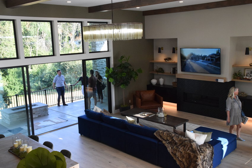 Attendees of the 2022 Parade of Homes mill about the &ldquo;Oak View,&rdquo; one of six homes on display at this year&rsquo;s festivities located in Ridgefield.