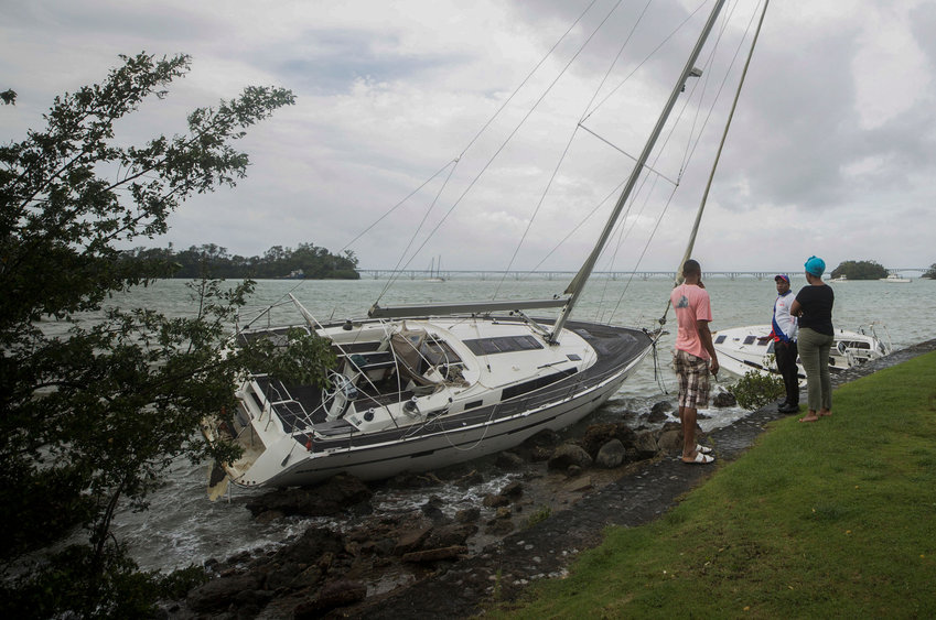 View of a sailboat dragged to the shore by strong waves in the Bay of Samana, after the passage of Hurricane Fiona, in Samana, Dominican Republic on September 20, 2022. - Hurricane Fiona dumped torrential rain on the Dominican Republic and left one person dead, after triggering major flooding in Puerto Rico and widespread power blackouts across both Caribbean islands. (ERIKA SANTELICES/afp/AFP via Getty Images/TNS)