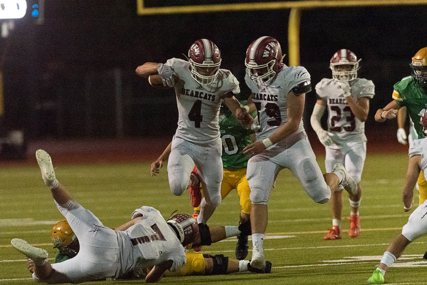 Gage Brumfield goes airborne to get extra yardage during W.F. West's 28-7 win over Tumwater on Sept. 30.