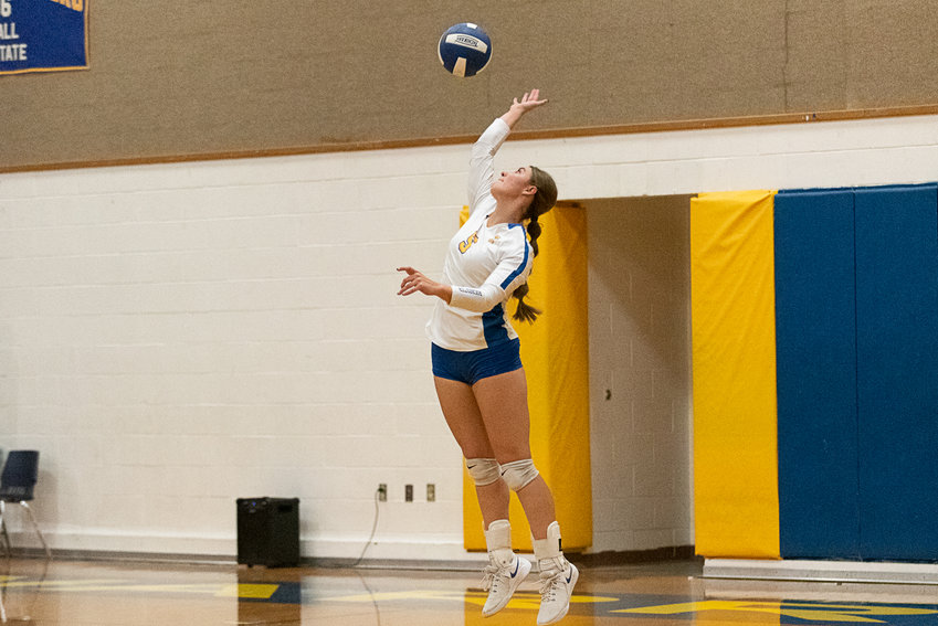 Rochester's Roisin Stull serves the ball during the Warriors' three-set loss to W.F. West on Oct. 4.
