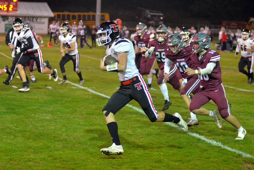 Tenino tailback Dylan Spicer takes a carry to the house against Hoquiam on the road Oct. 7.